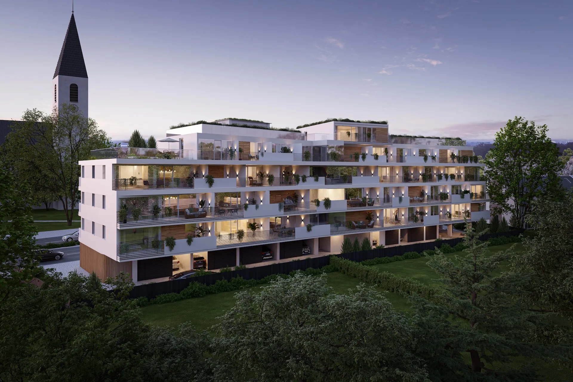 Mehrfamilienhaus mit Staffelgeschoss, Gartenseite in der Dämmerung